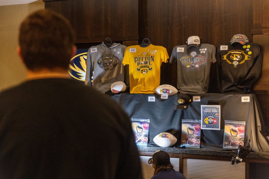 Shirts and sweatshirts are on display at the Mizzou Cotton Bowl merch store at the Hilton Anatole in Dallas.