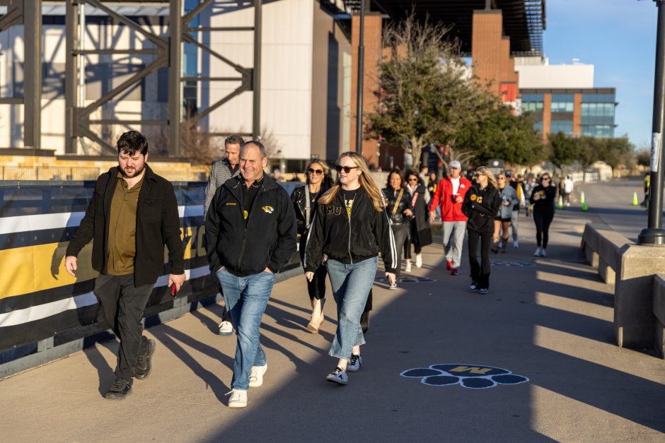 Mizzou fans and alumni walk from the MAA Alumni tailgate at Globe Life Field to the Cotton Bowl at AT&T Stadium.  