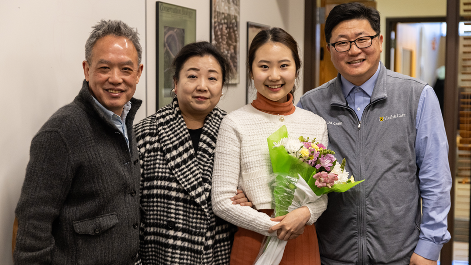 Jenny Park with her parents and mentor.