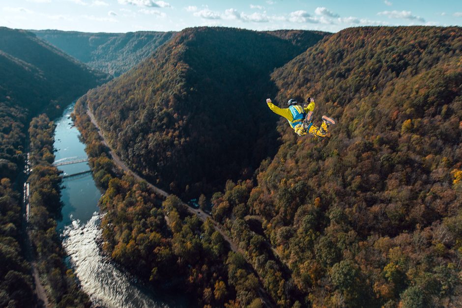 parachuter freefalling off bridge