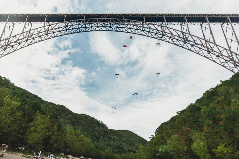 parachuters descending from bridge