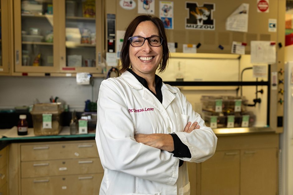 Teresa Lever in lab coat smiling 
