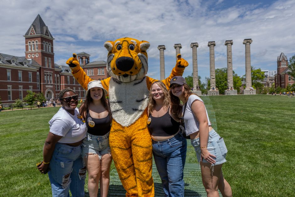 Four students with Truman mascot