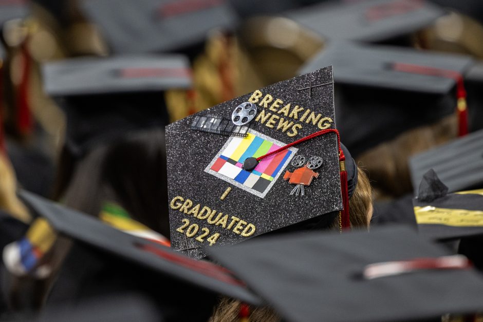 Mortar board decorated with 'breaking news'