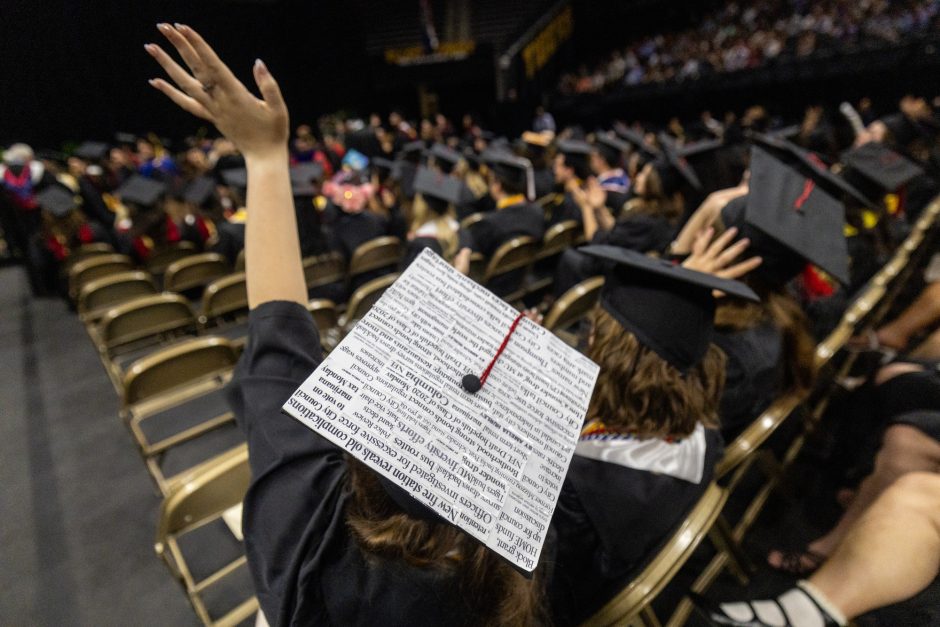 Mortar board decorated with newspaper headlines 