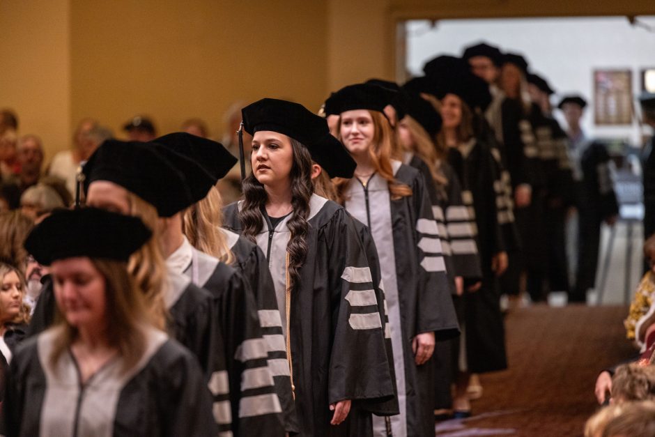 Graduates walk in line