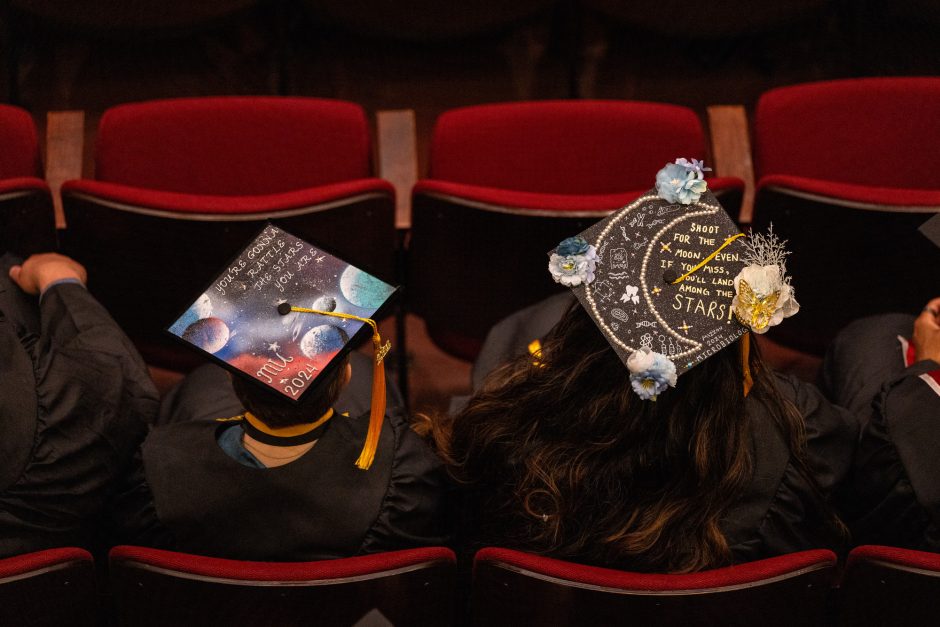 Mortar boards decorated with planets, stars