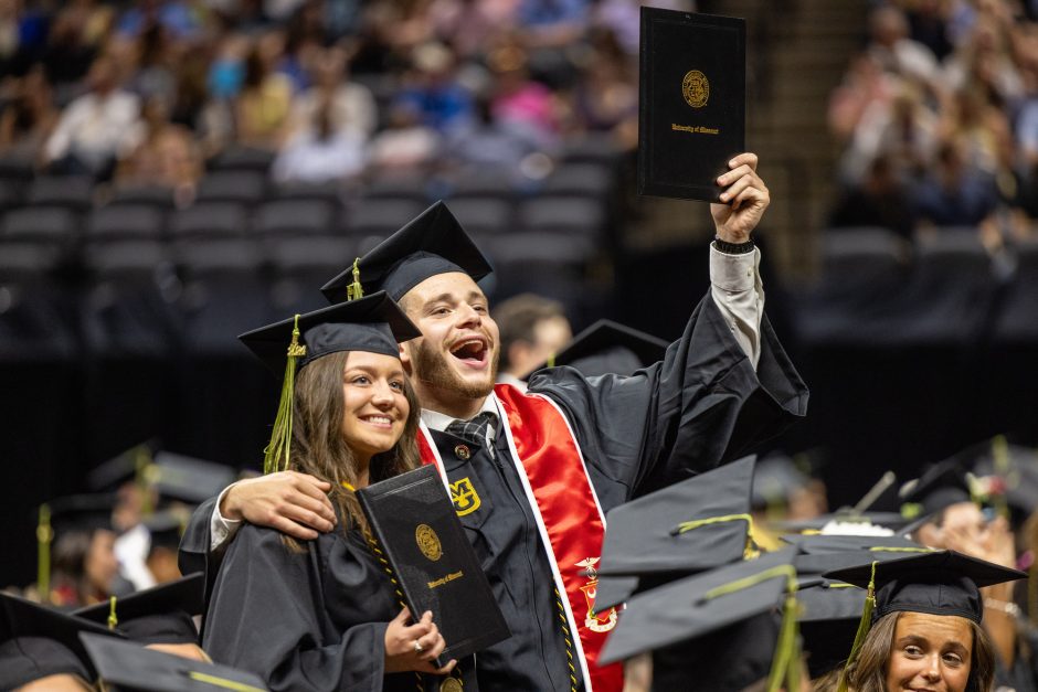 Graduates hold up degree