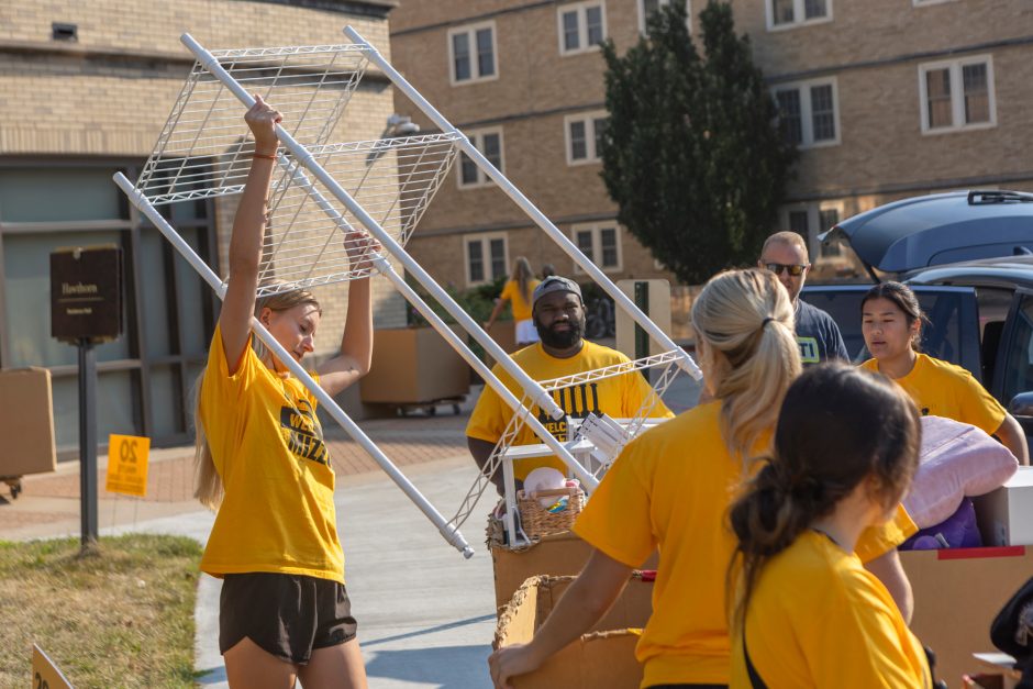 Students move belongings