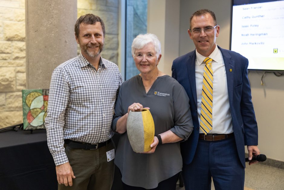 Three people with pottery