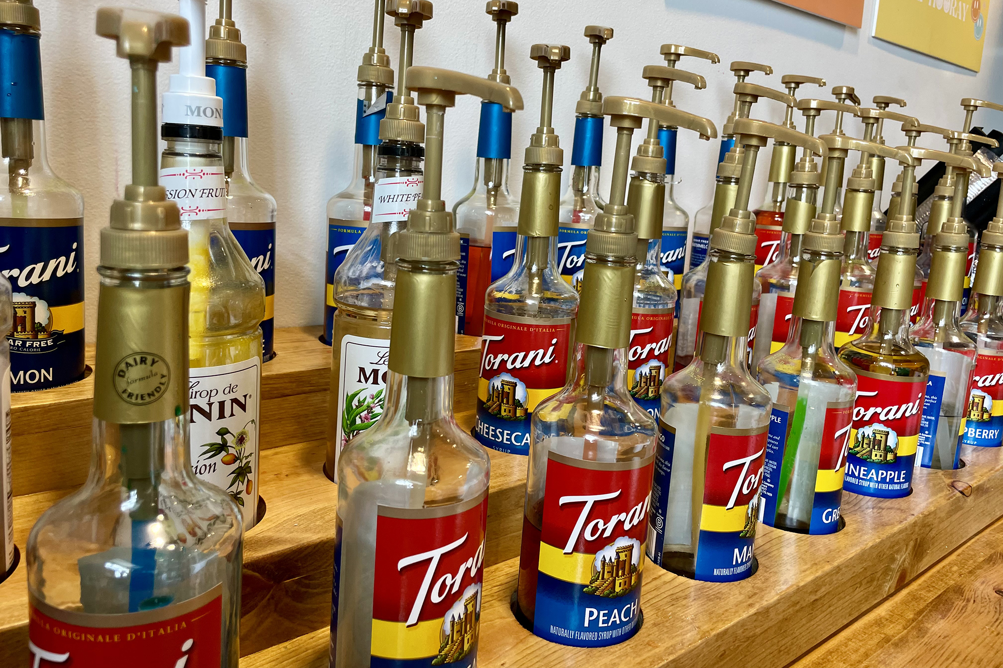 row of simple syrup bottles