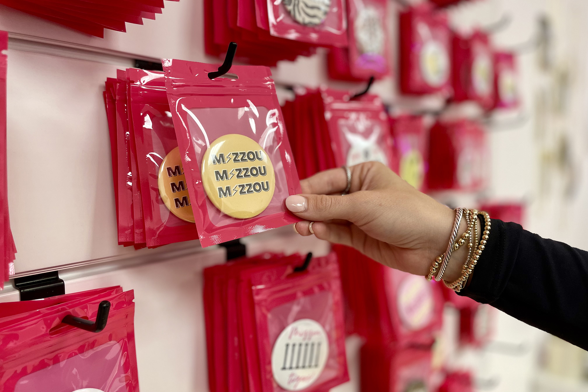 hand touching buttons on a display