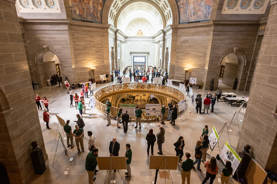 Students presenting their research at the state capitol building.