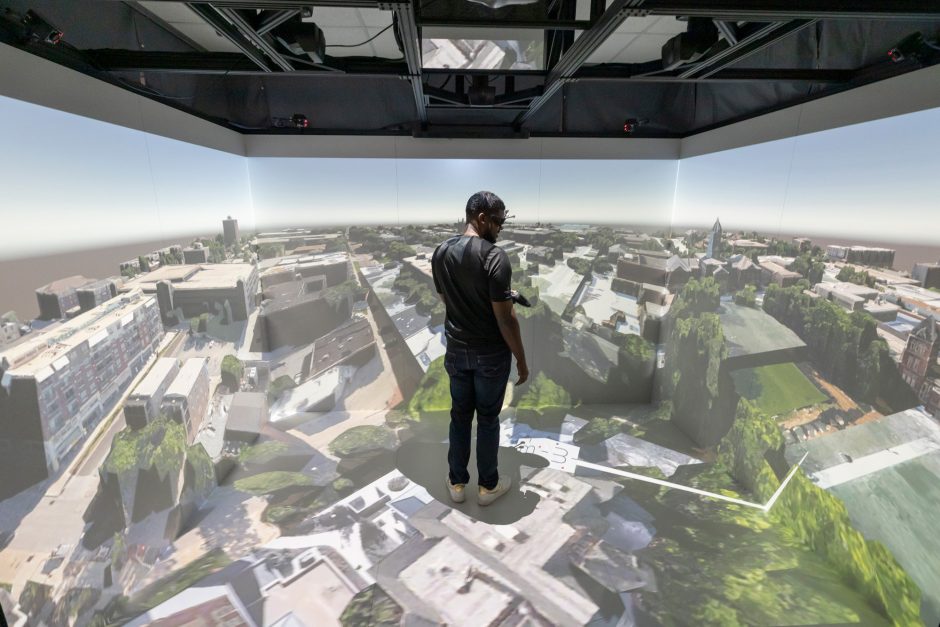 Student surrounded by virtual reality in the CAVE