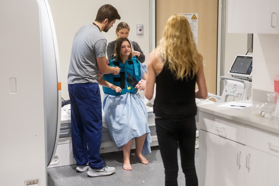 Hannah Gryder surrounded by a medical team.