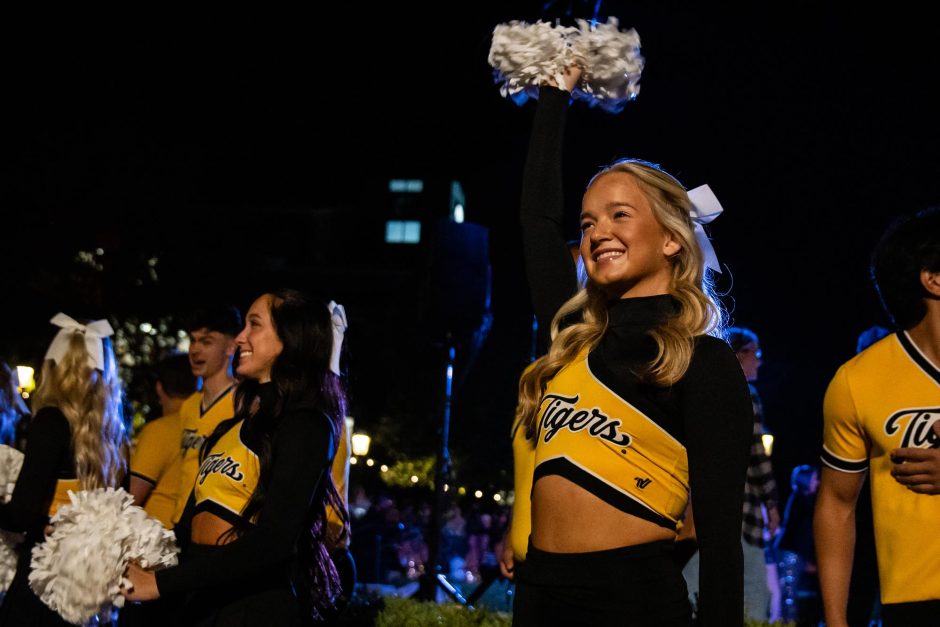 Cheerleaders raise pom poms at spirit rally