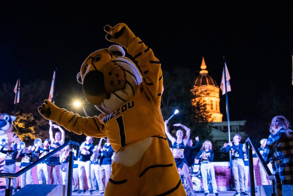 Truman raises arms at spirit rally