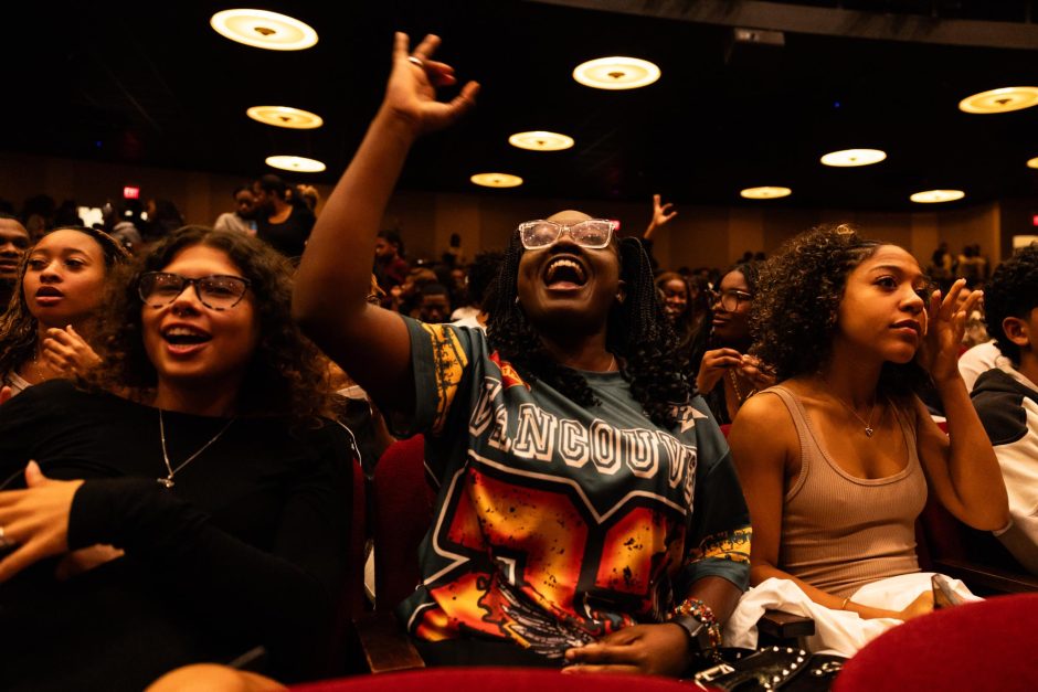 Students cheer in crowd at step show