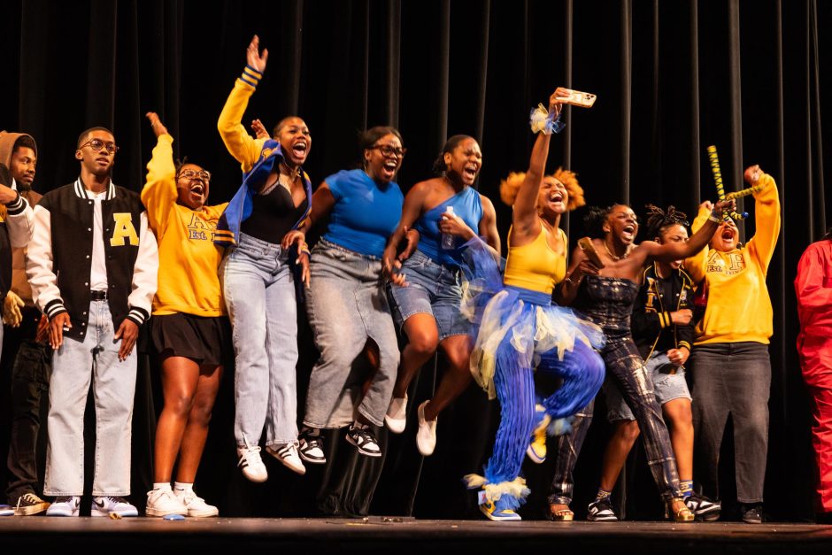 Students jump while taking selfie at step show