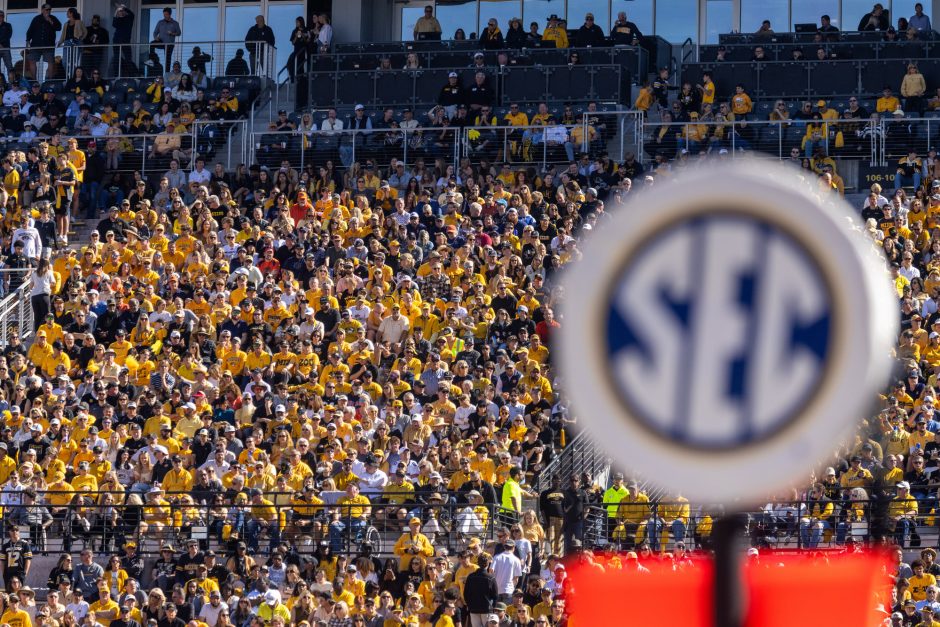 SEC sign in front of crowd