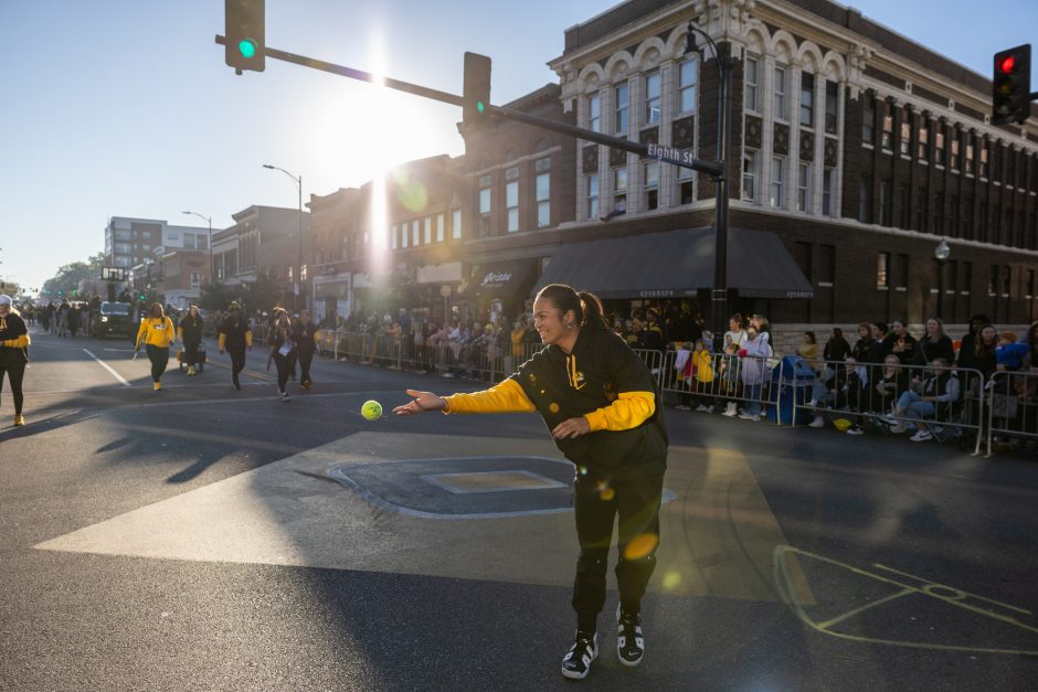 Student tosses ball into crowd