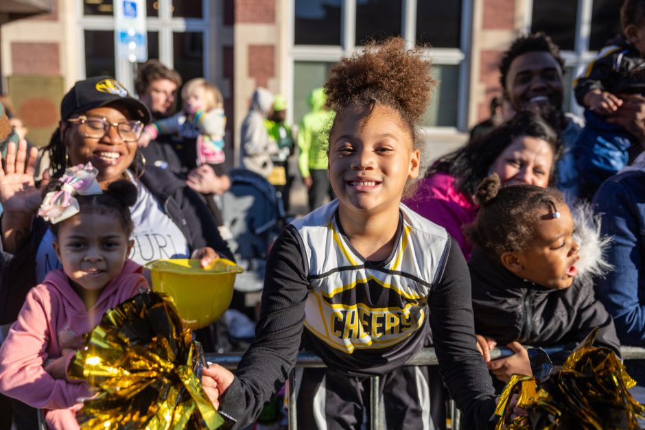 Young girl smiles at camera in Mizzou shirt