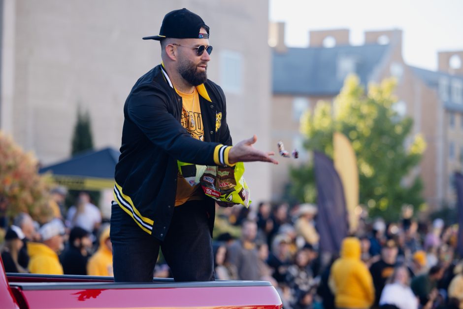 Man passes out candy at parade