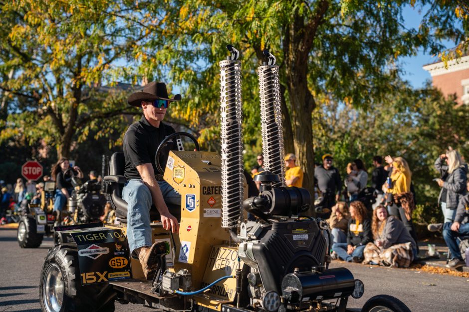 Man drives tractor in parade