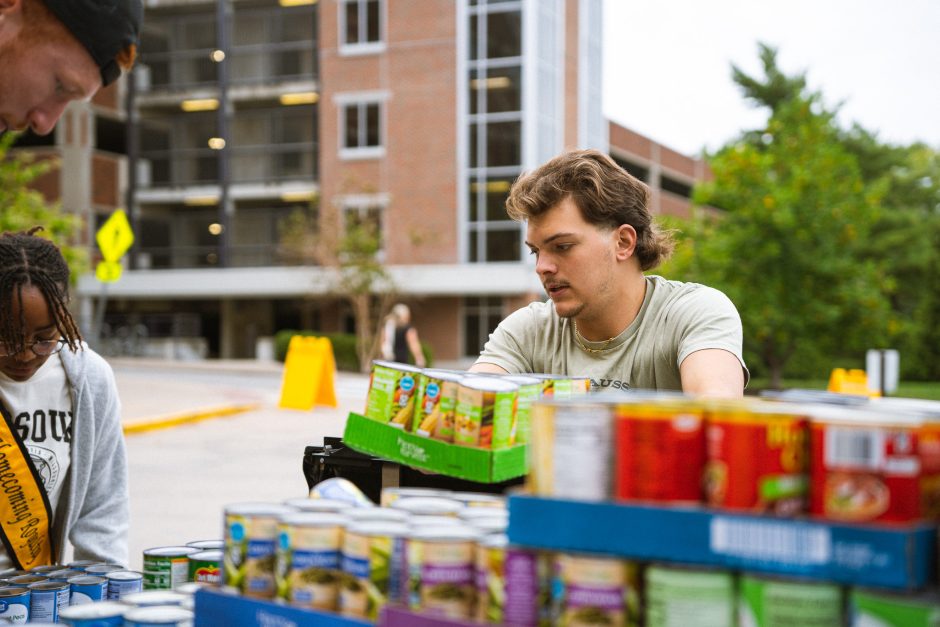 Student sorts canned food