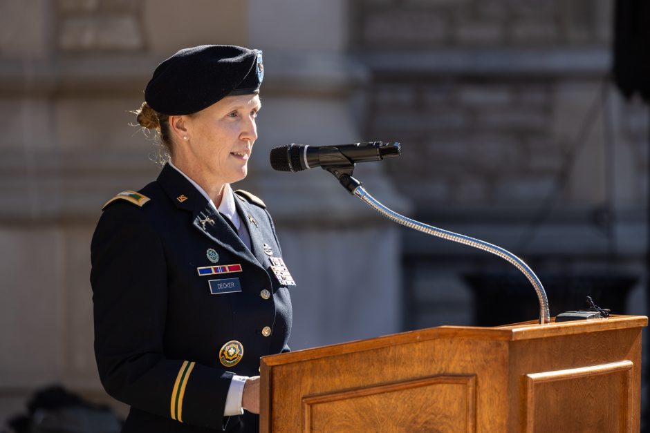 Woman speaks at wreath-laying ceremony