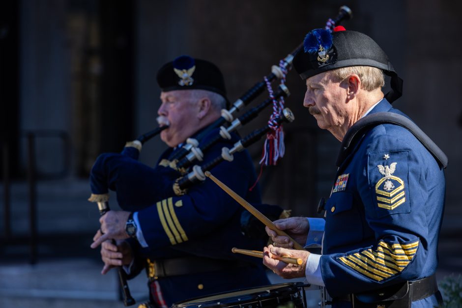 Service members play drums at ceremony