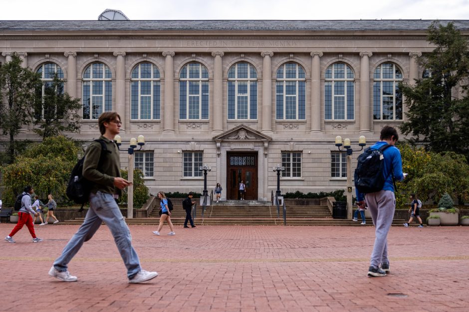 Students walk in front of building