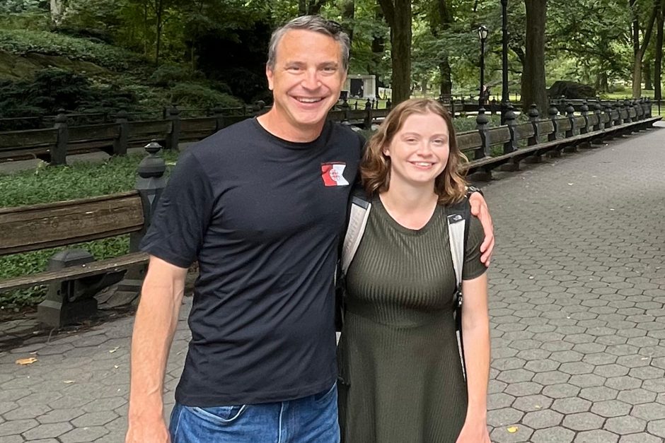 Chuck Adamson and daughter, Hope, stand in park