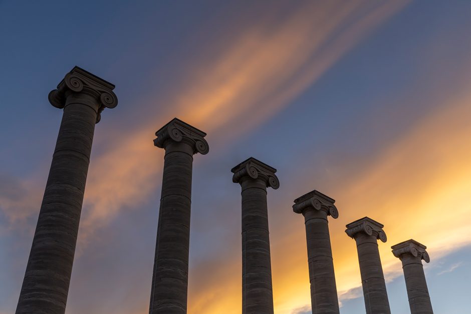 Gold clouds above columns on campus