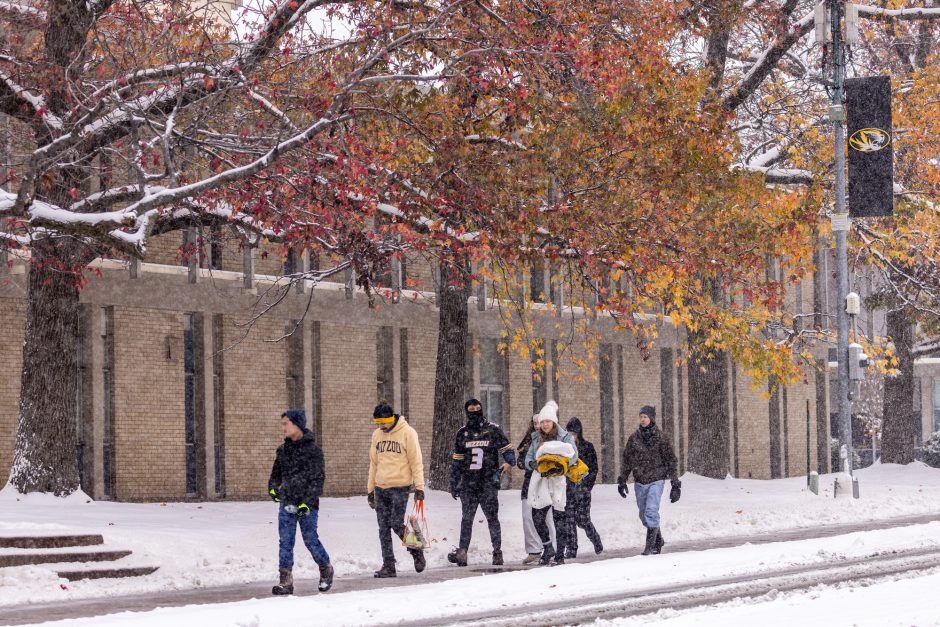 People walk in snow