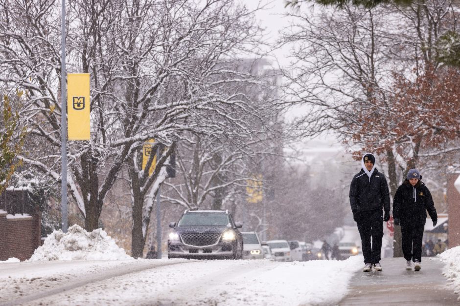 People walk in snow