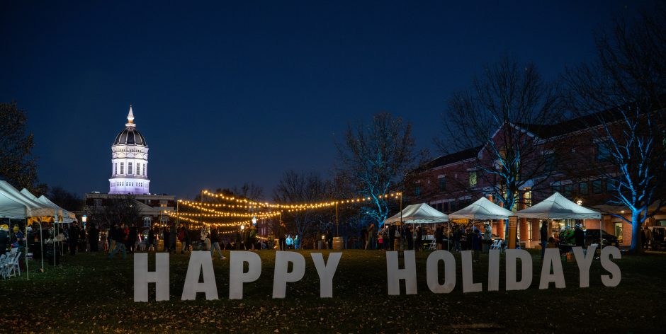 Happy holidays signage in front of building