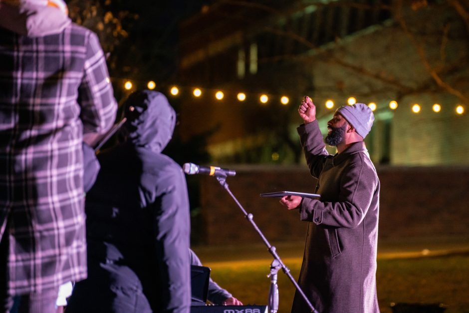 People talk at Deck the Columns holiday event