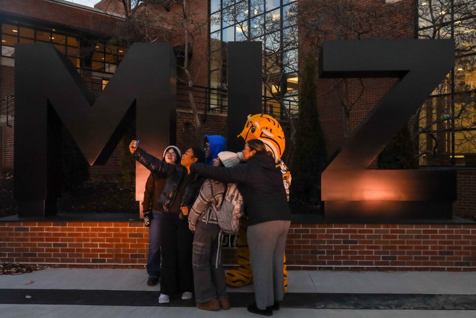 People take selfie with Truman Tiger mascot