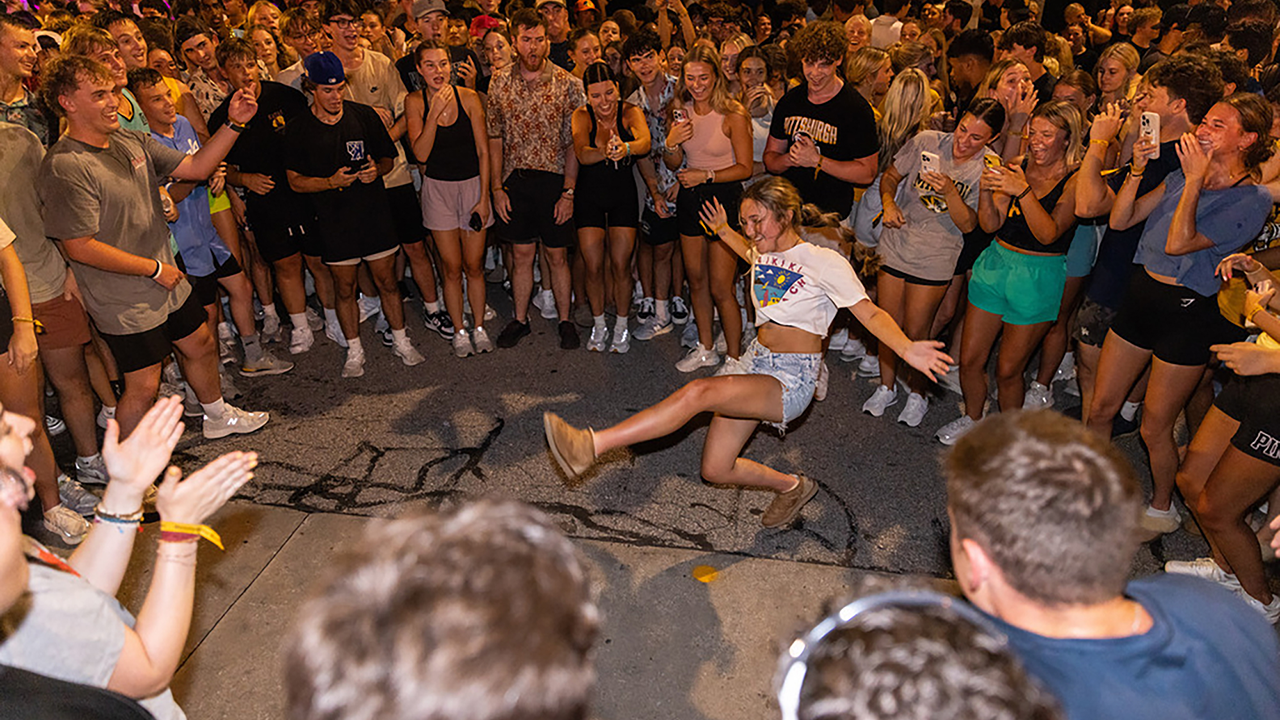 Student dances in crowd