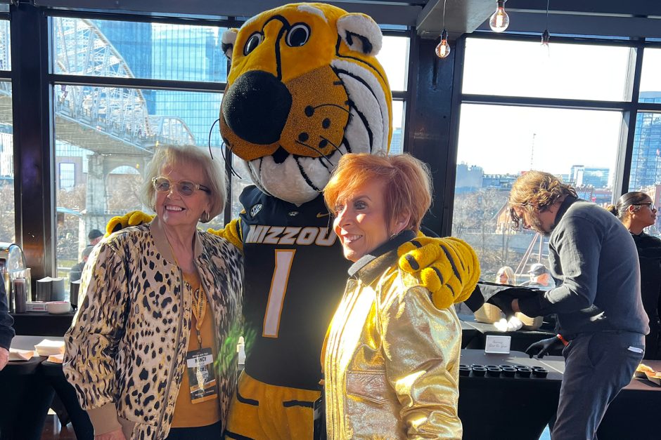 Two women with Truman mascot