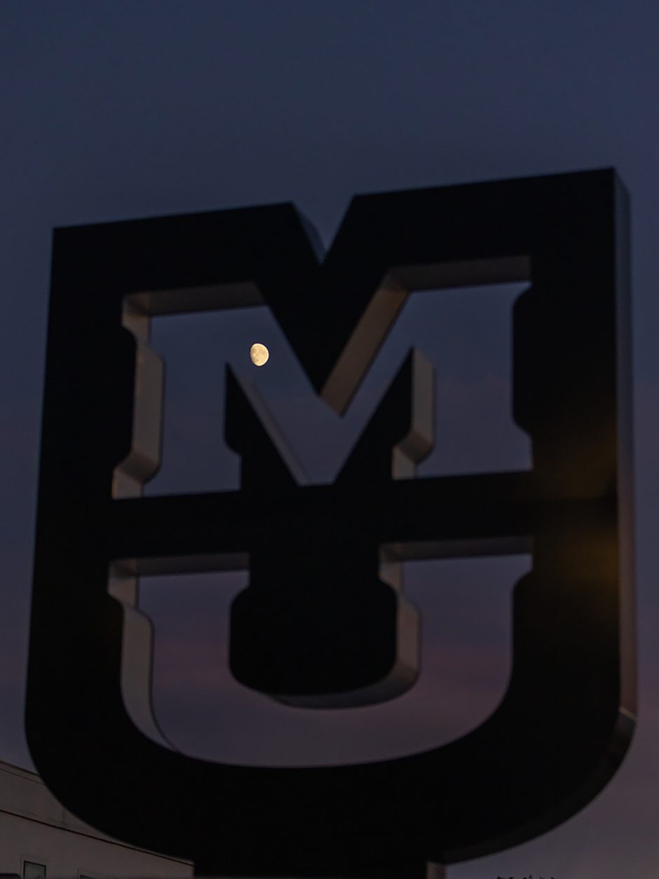 Moon is shown through an MU sign