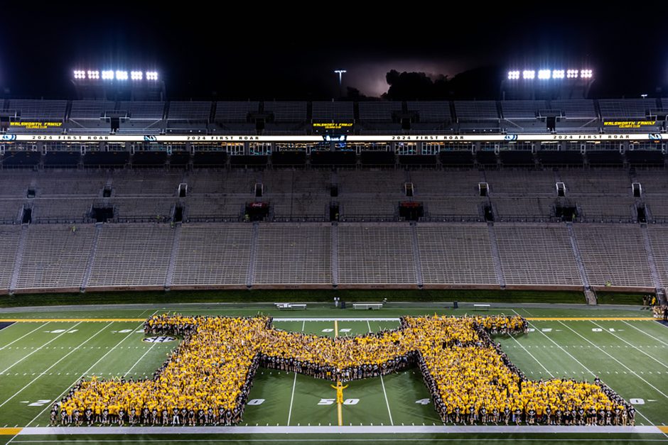 People form an M on Faurot Field