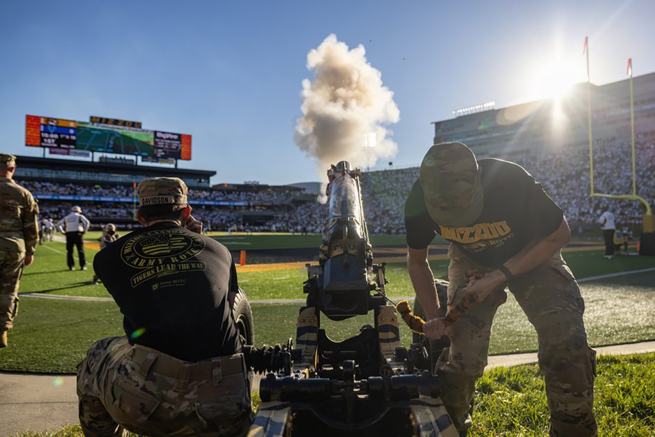 ROTC cadets fire cannon at football game