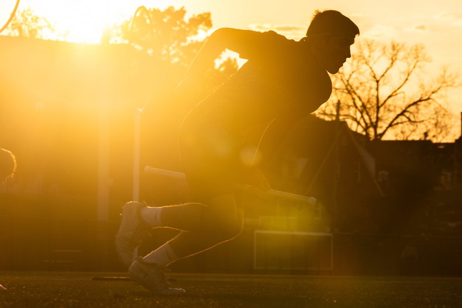 Person running with sunlight behind him