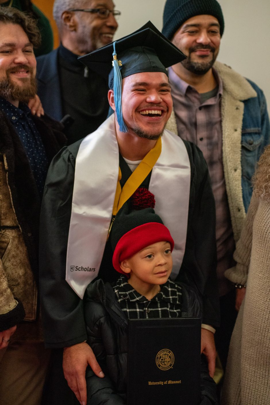 Graduate and child