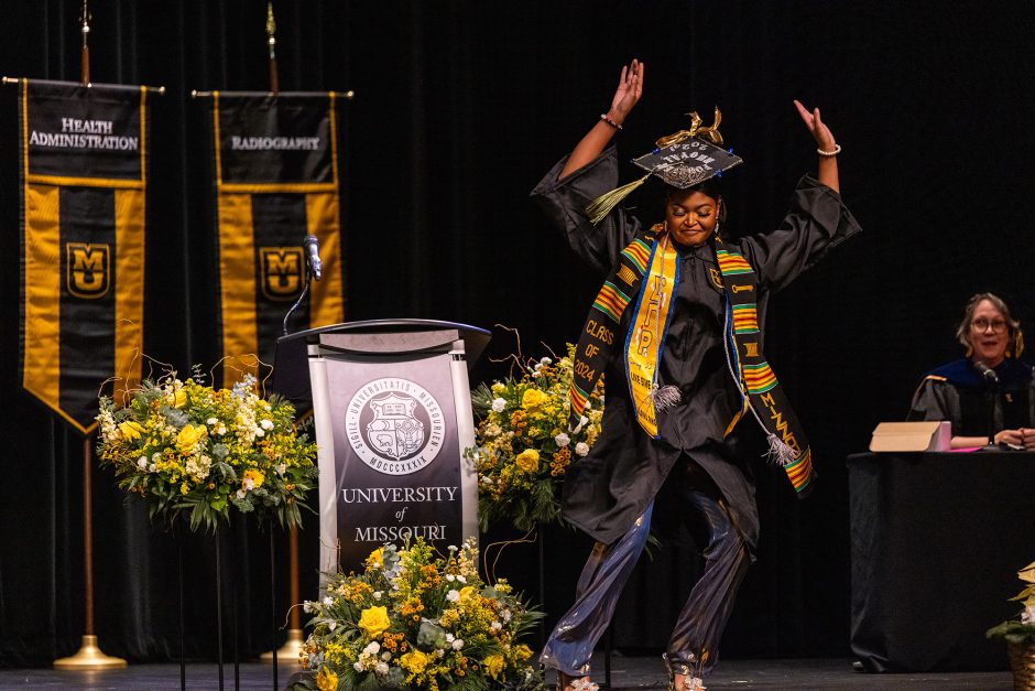 Graduate celebrates on stage