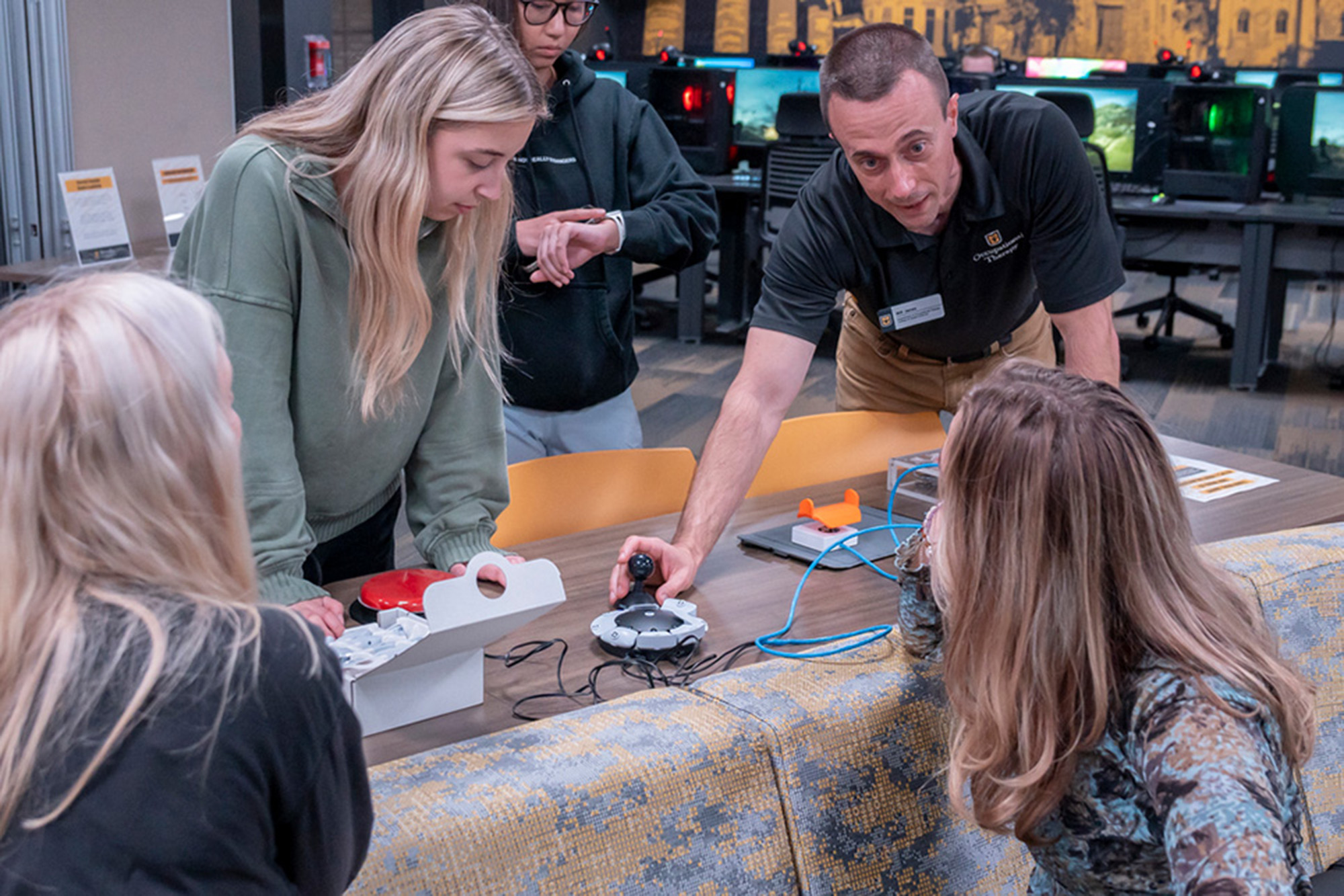 People look at equipment on table