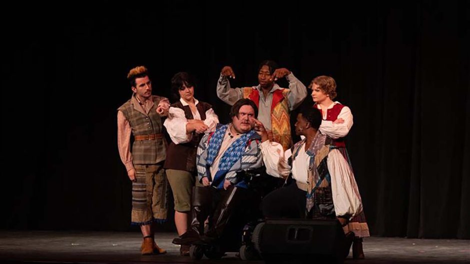 Mizzou students perform in a play on stage.