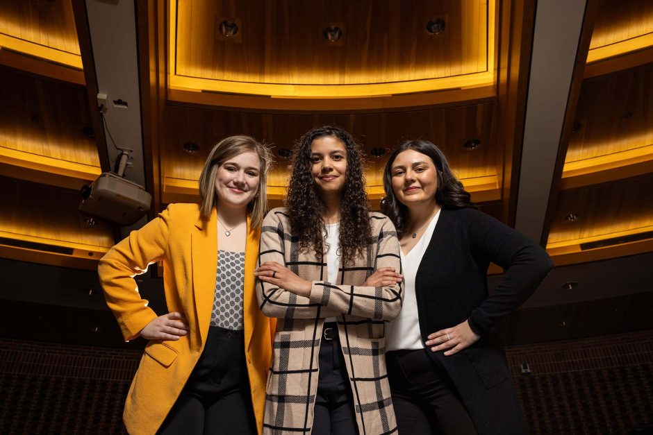 Posing in the courtroom at the MIzzou School of Law are Erika LeFauve, Danielle Dodd and Mariana Larson. 